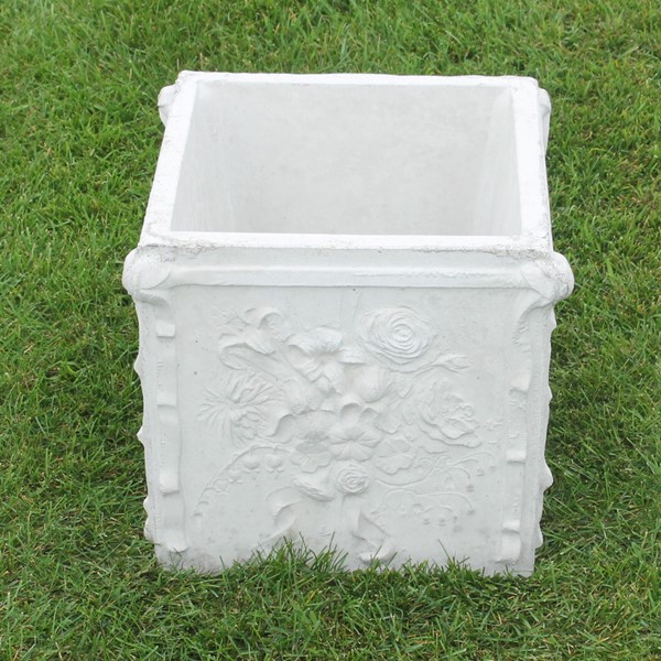 A square planter with a very unique and dainty rose detail. 
