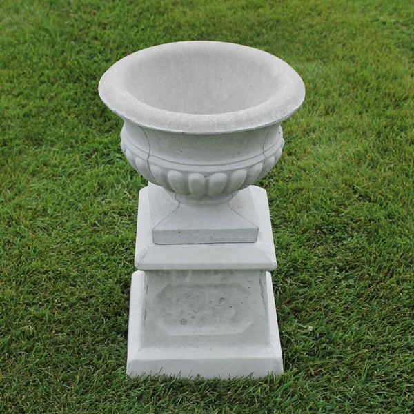 A small empire planter with a very traditional look on a small base 