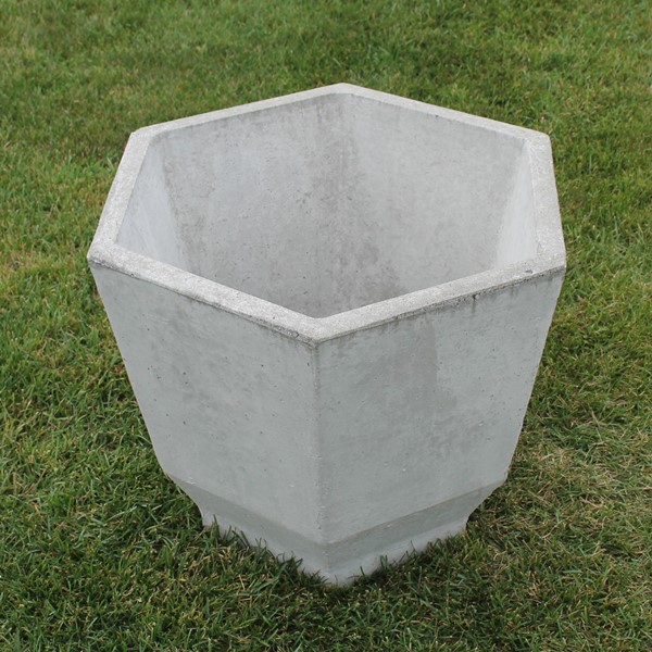 An octagon shaped planter with smooth sides and a simple look.