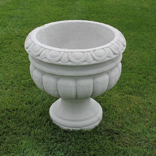 A large planter with simple scroll and curved design.
