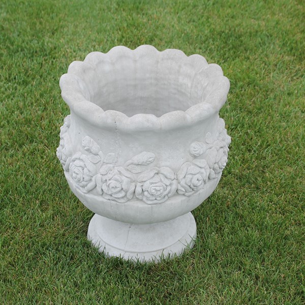 A rounder style of a rose detailed planter.