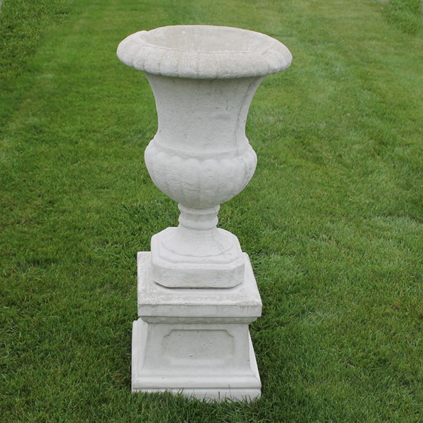 The cast iron urn planter on a medium base pedestal.