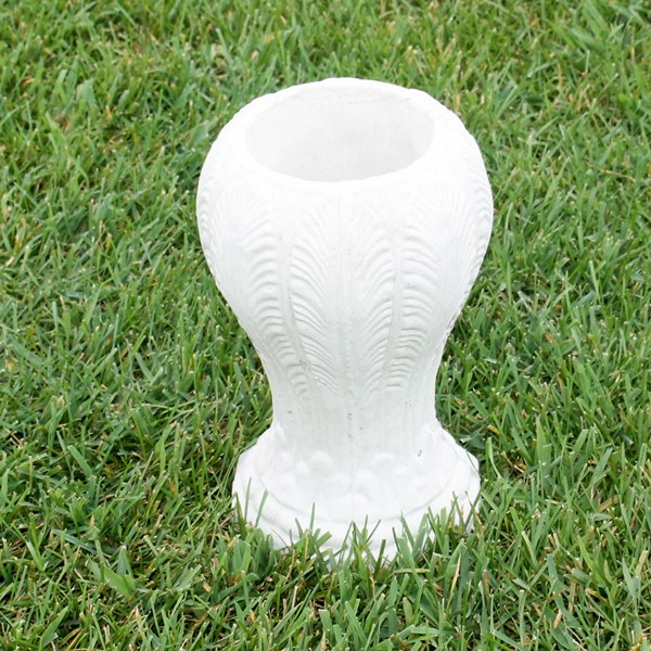 This small vase has a nice fern or leaf detail that goes all around the outside.